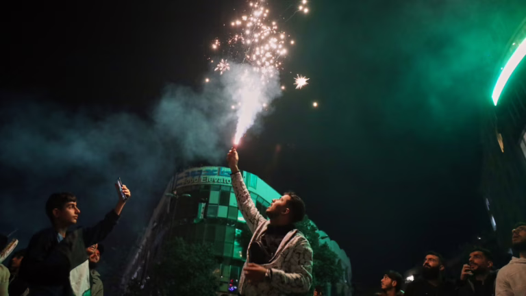 Syria celebrates U.S. lifting sanctions, year without Assad : NPR